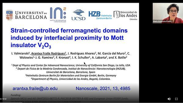 Strain-controlled ferromagnetic domains induced by interfacial proximity to Mott insulator V2O3