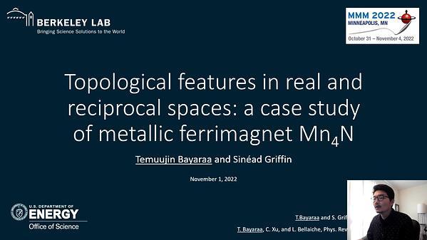 Topological features in real and reciprocal space: a case study of metallic ferrimagnet Mn4N