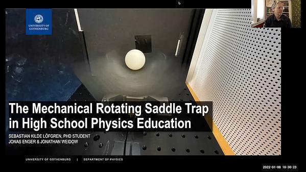 The Mechanincal Rotating Saddle Trap in High School Physics Education